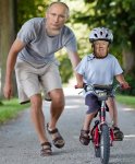 Daddy Putin and Trumpy on his bike.jpg